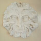 Bas relief sun in plaster