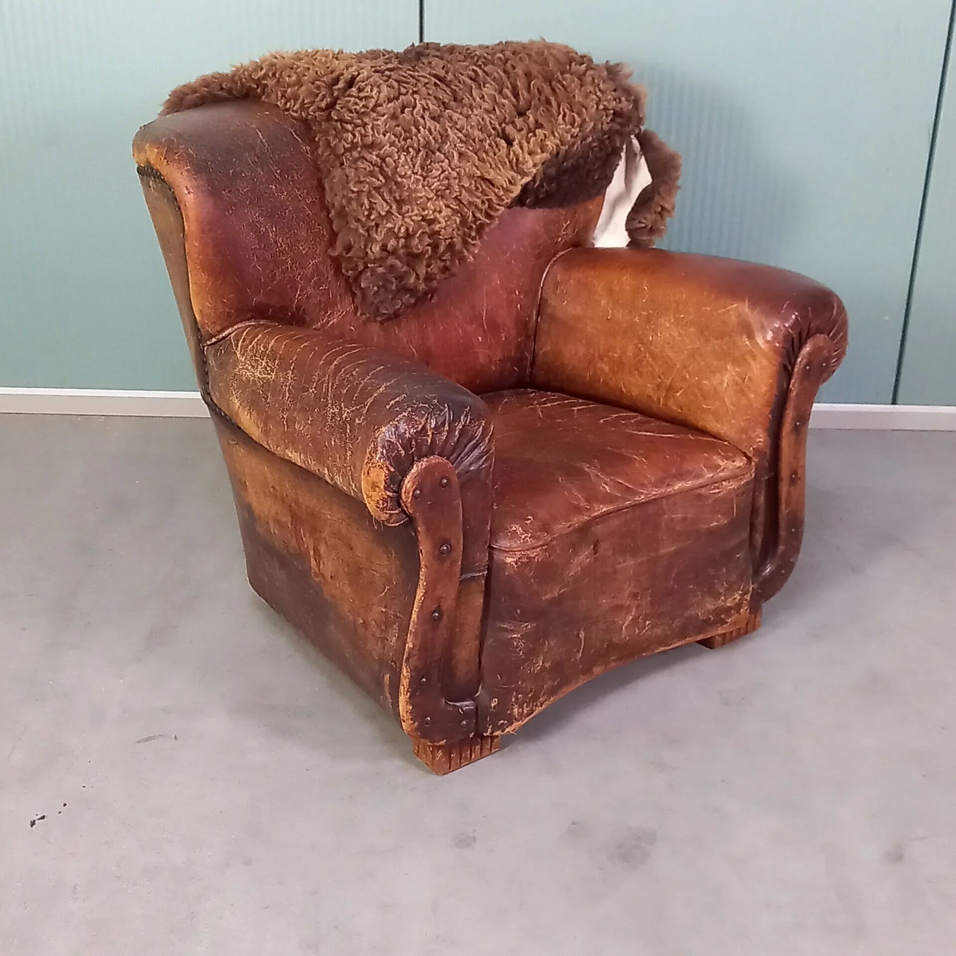 Leather nailed armchair