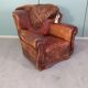 Leather nailed armchair