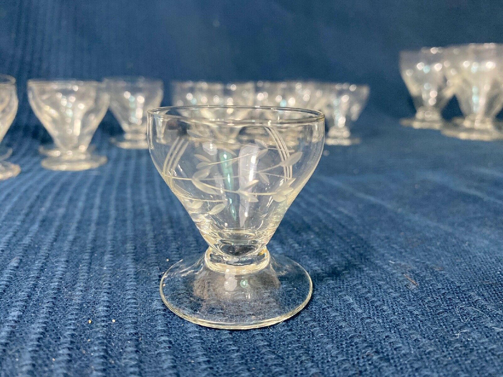 Set of 12 hand-sized crystal glasses with flower decoration
