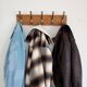 Wall-mounted coat rack with 5 vintage-style hooks in patinated wood and metal.