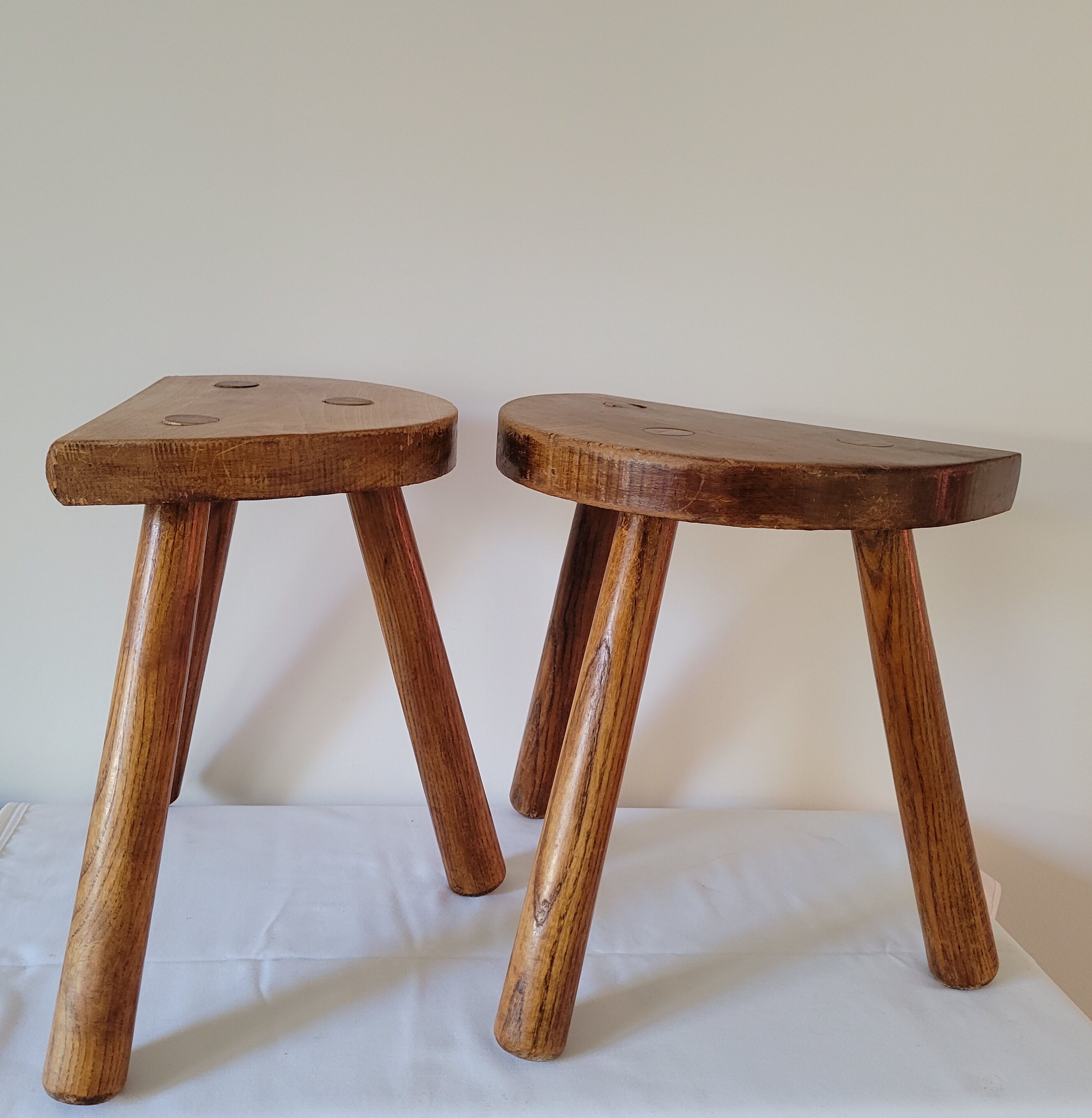 Pair of half-moon tripod stools