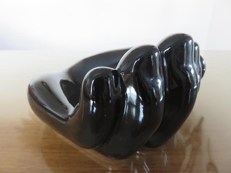 "hand" in black ceramic trinket bowl 60/70