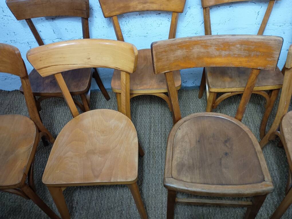 Set of 9 mismatched bistro chairs, 1950s.