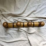 Antique wall-mounted coat rack in turned bamboo-style wood