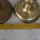 Pair of brass pusher candlesticks