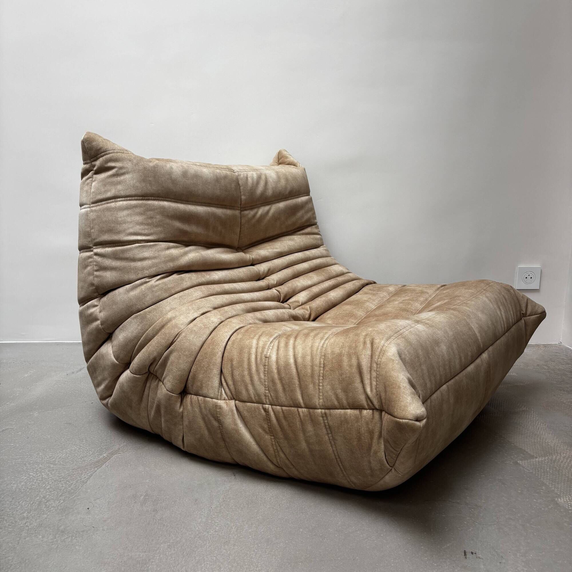 Amber beige Togo armchair by Michel Ducaroy for Ligne Roset.