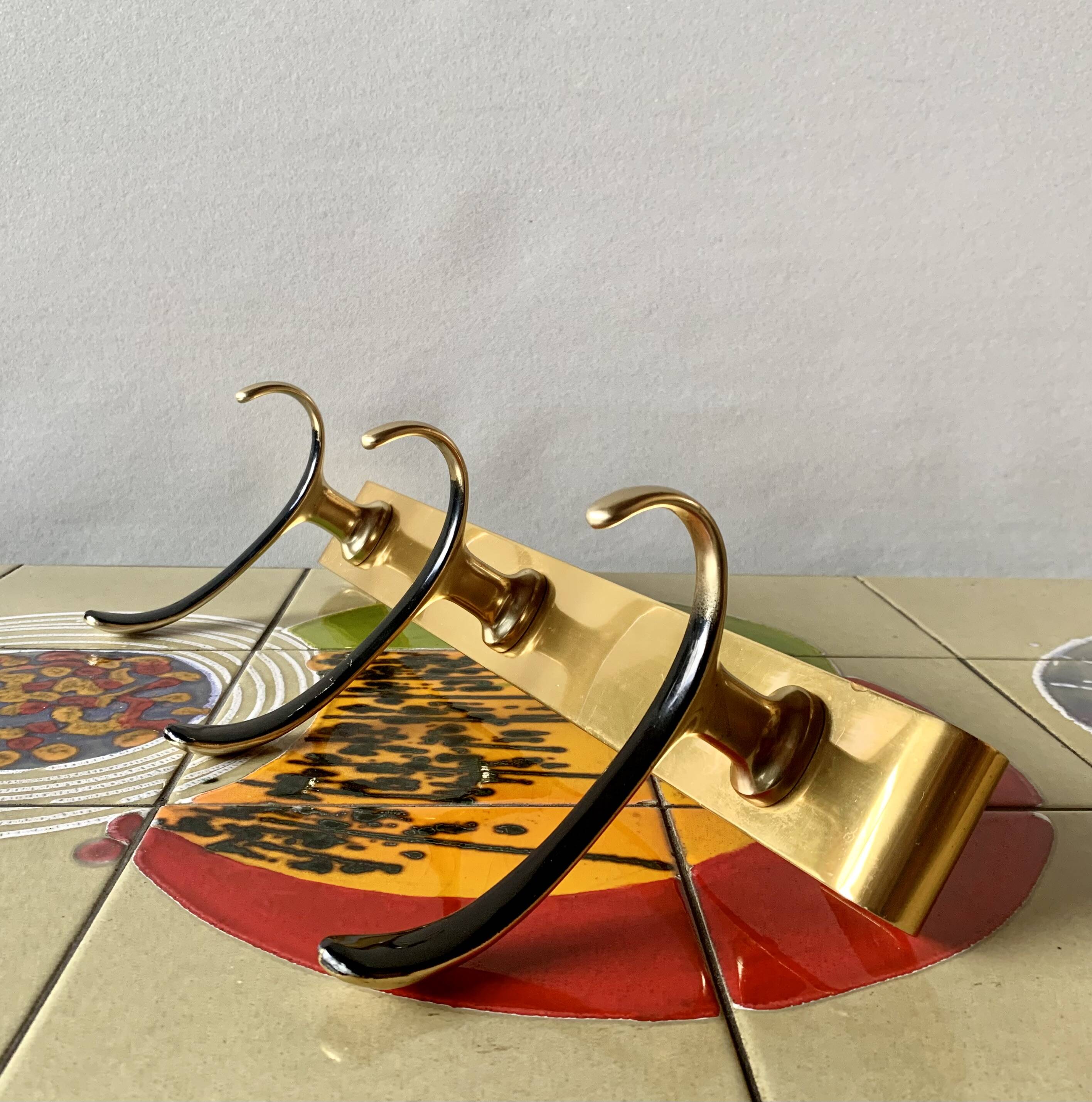 Vintage wall-mounted coat rack in golden aluminum - triple coat hook