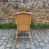 Rattan armchair with armrests