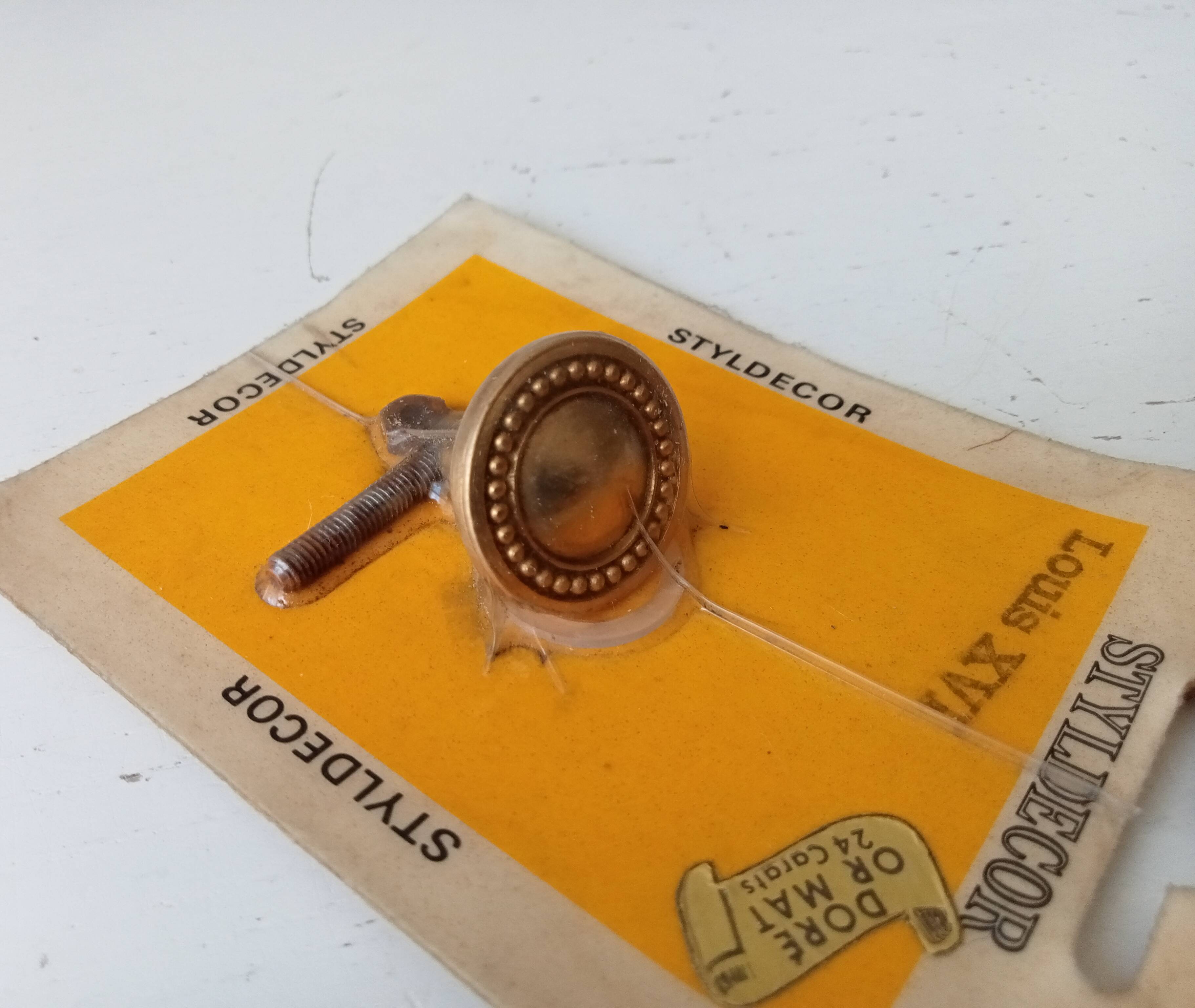 Vintage furniture knob in Louis XVI style, gilded with fine gold.