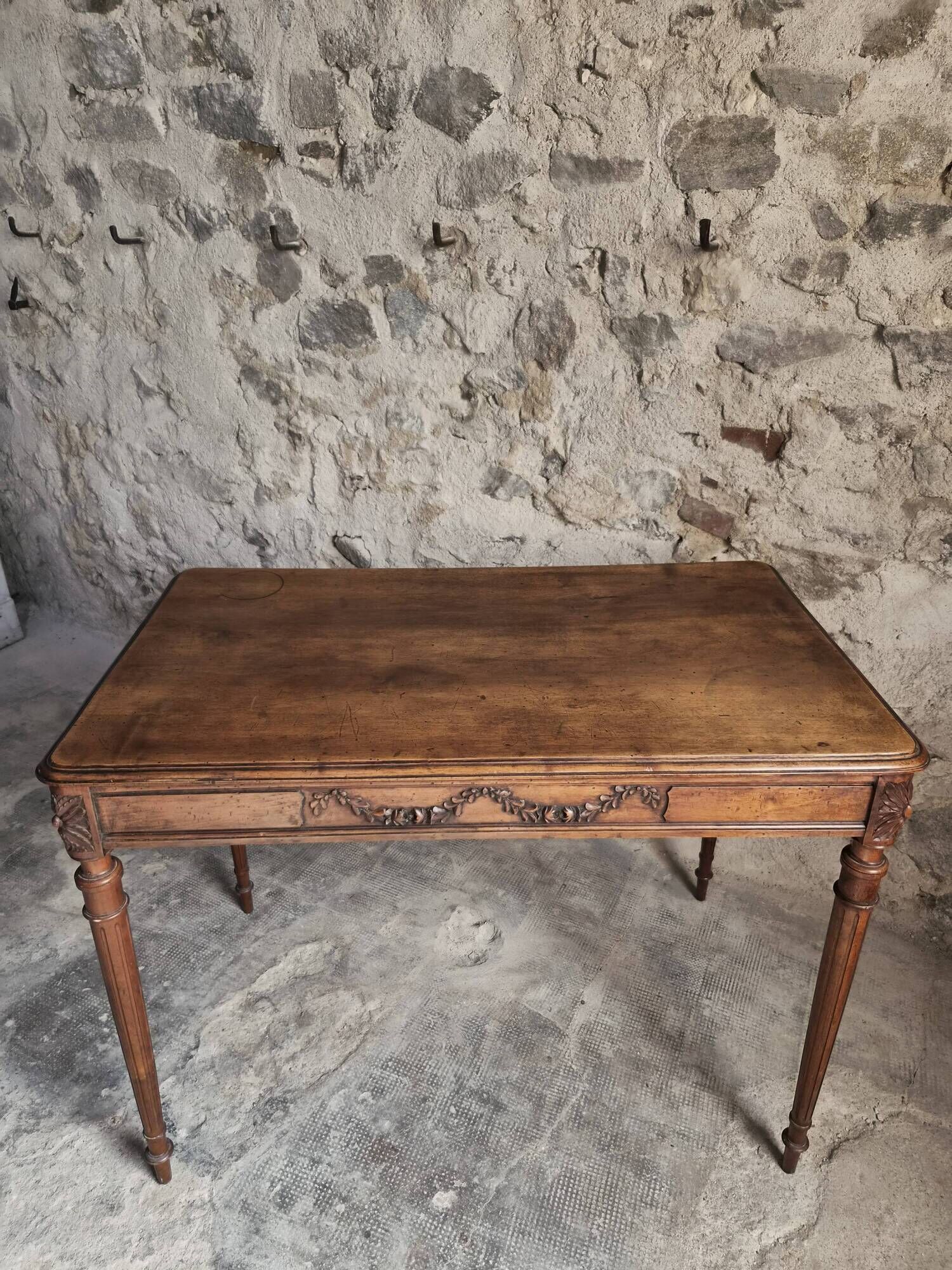 French antique writing desk in walnut, Louis XVI style, late 19th century, circa 1880–1900.