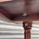 19th-century solid mahogany table with a tilting top and brass mechanism.
