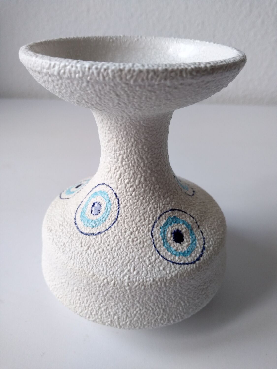 White and blue ceramic vase with italian relief