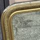 Louis Philippe mirror in gilded wood with an openwork frieze and mercury glass.