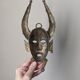 Handcrafted bronze wall mask, Sénoufo African art.