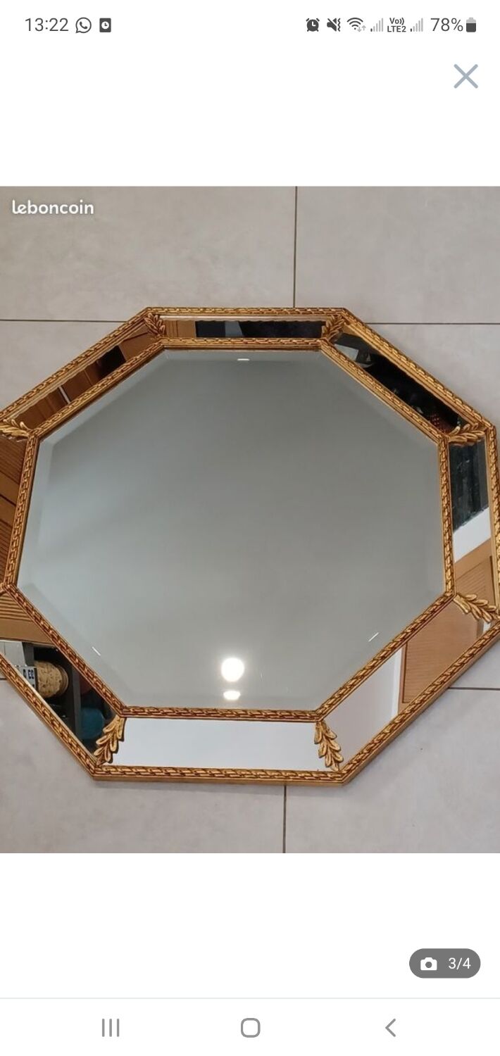 Octagonal mirror with golden wood frame