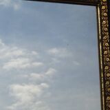 Mirror with black and gold frame, embossed vine leaves