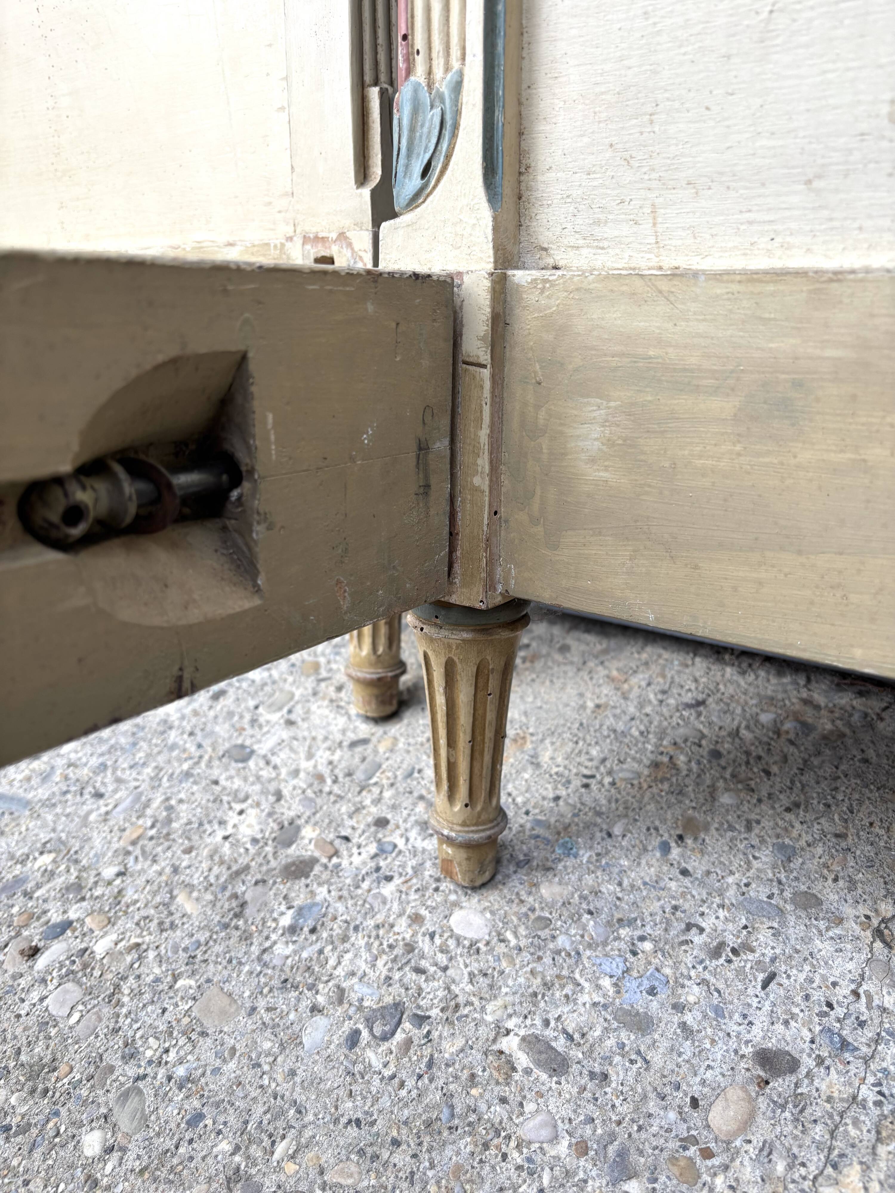 Carved and painted wooden bed