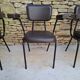 Brown faux leather armchairs