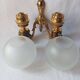 Wall lamp in gilded bronze with a lion's head and engraved globe.
