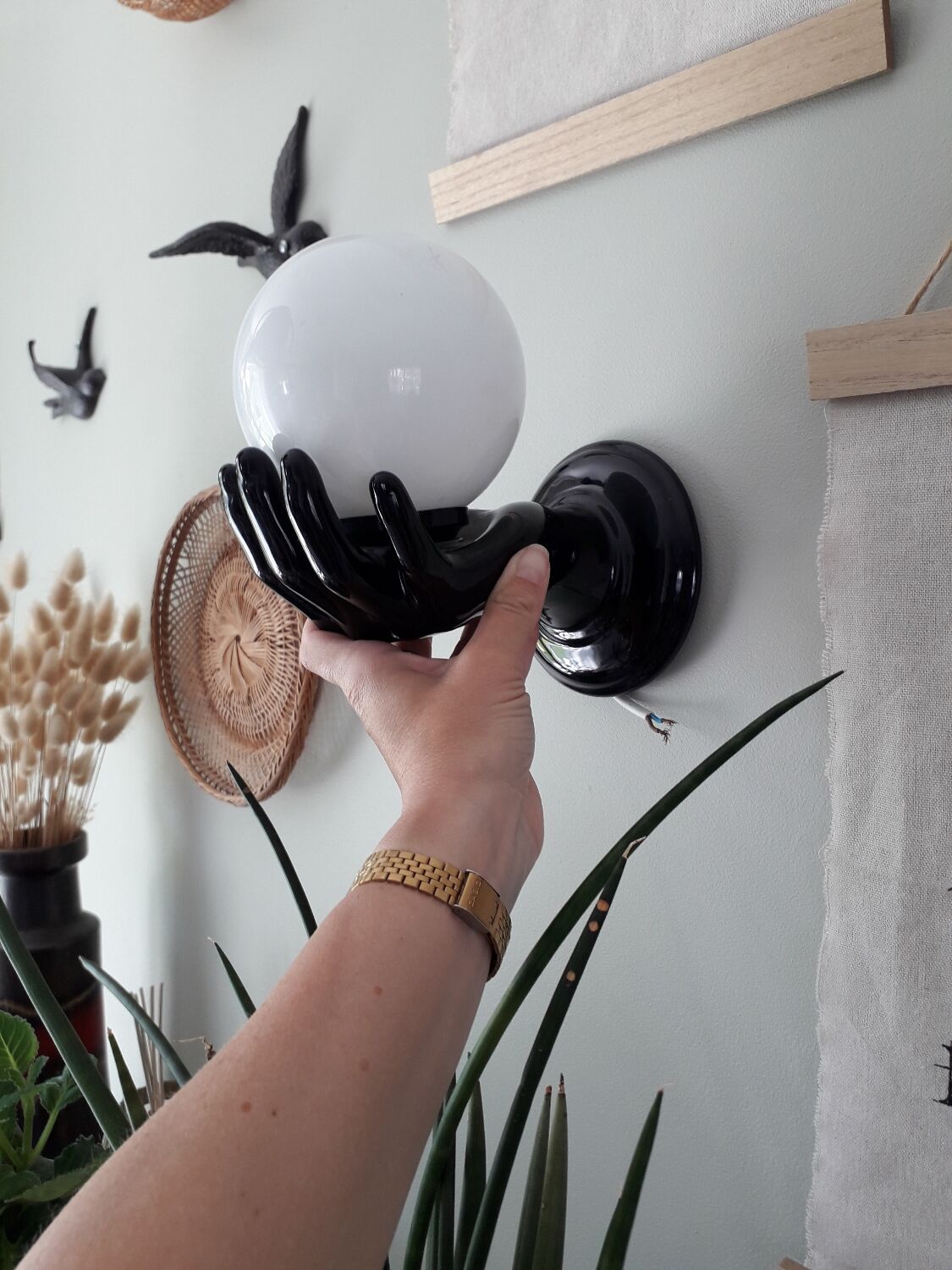 Hand and opaline globe wall light
