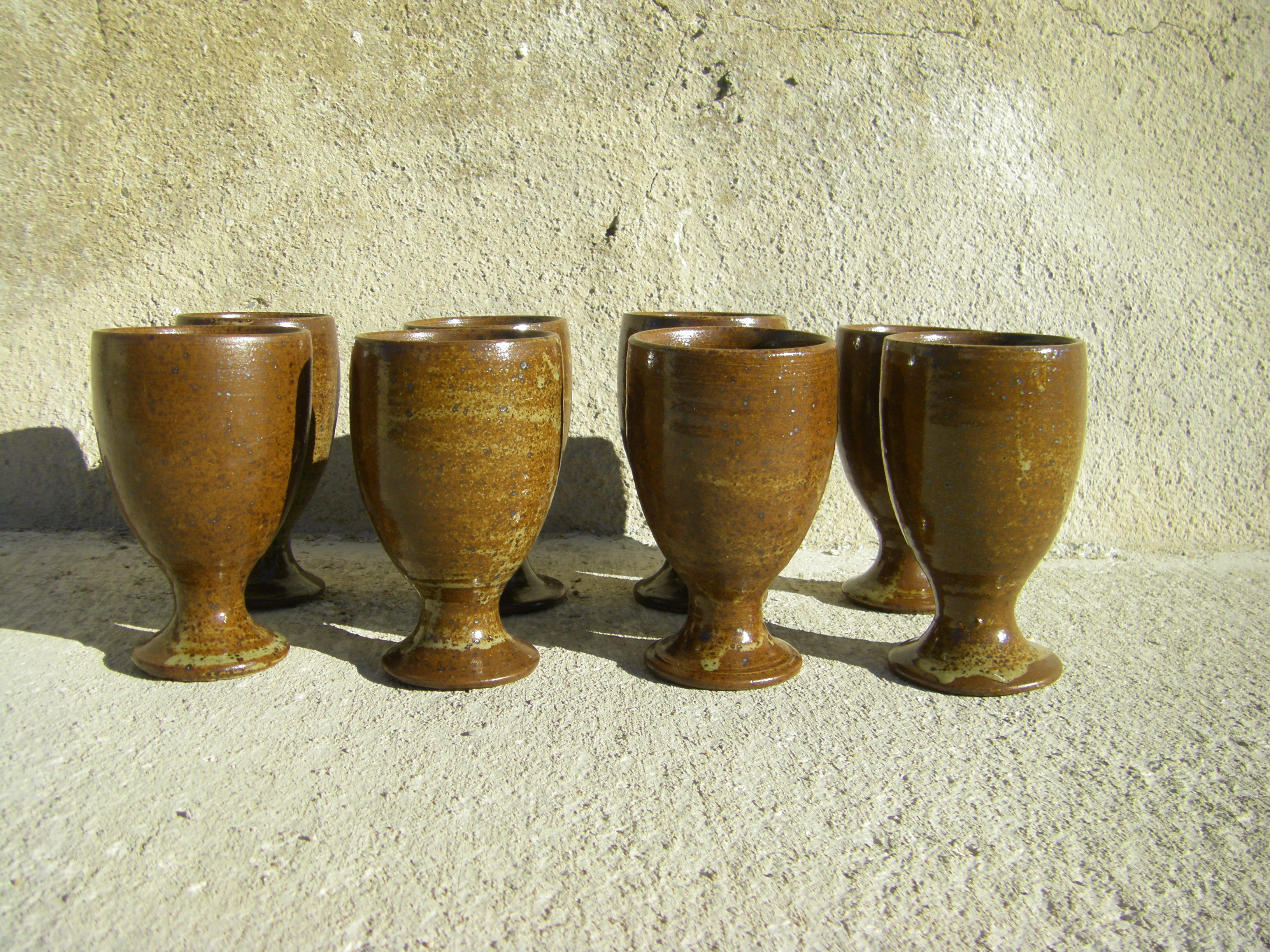 Eight vintage stoneware walking glasses