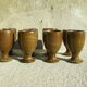Eight vintage stoneware walking glasses