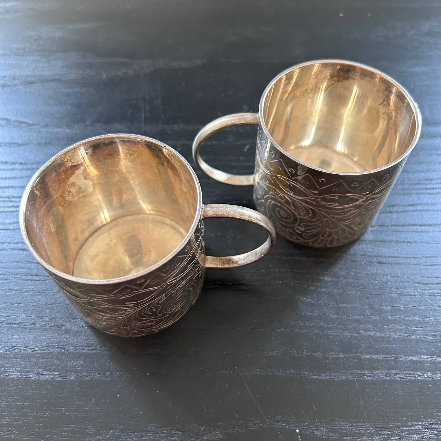 Pair of chiseled silver cups