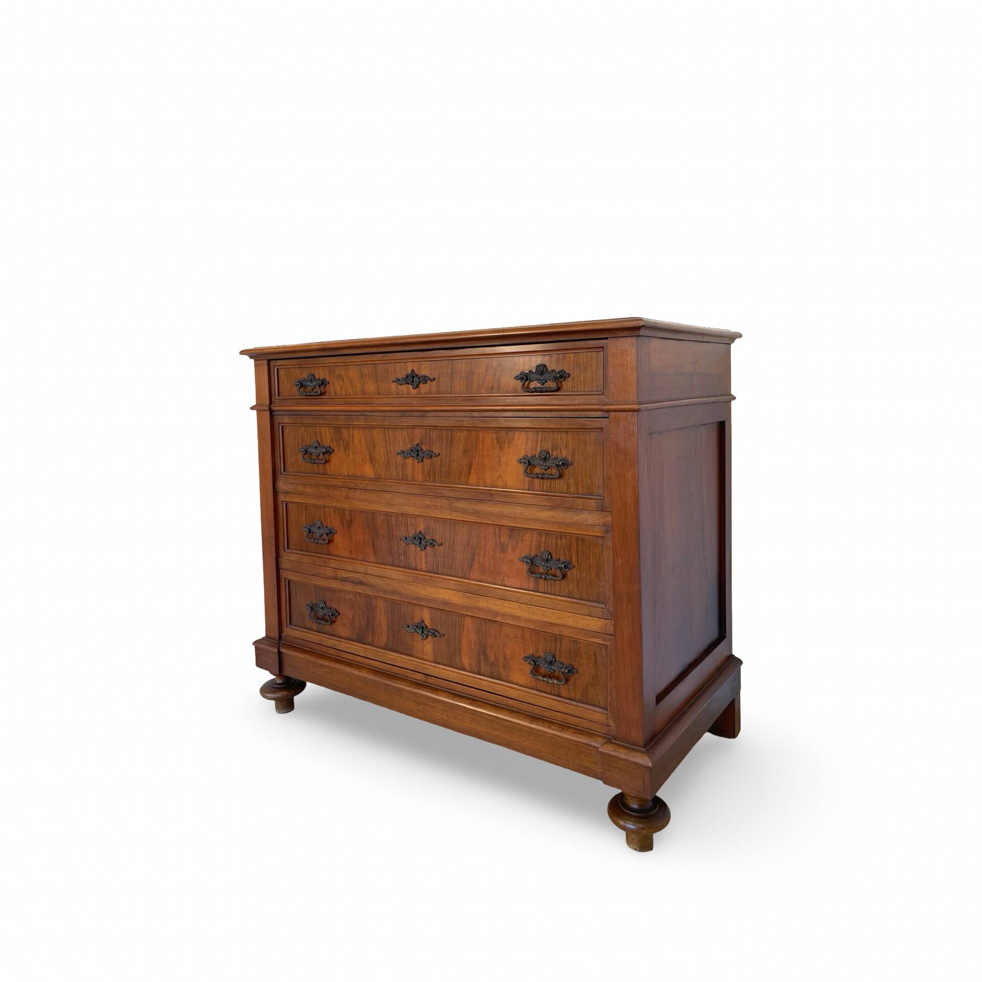 Antique walnut commode with bronze handles in the shape of a lion's mask,