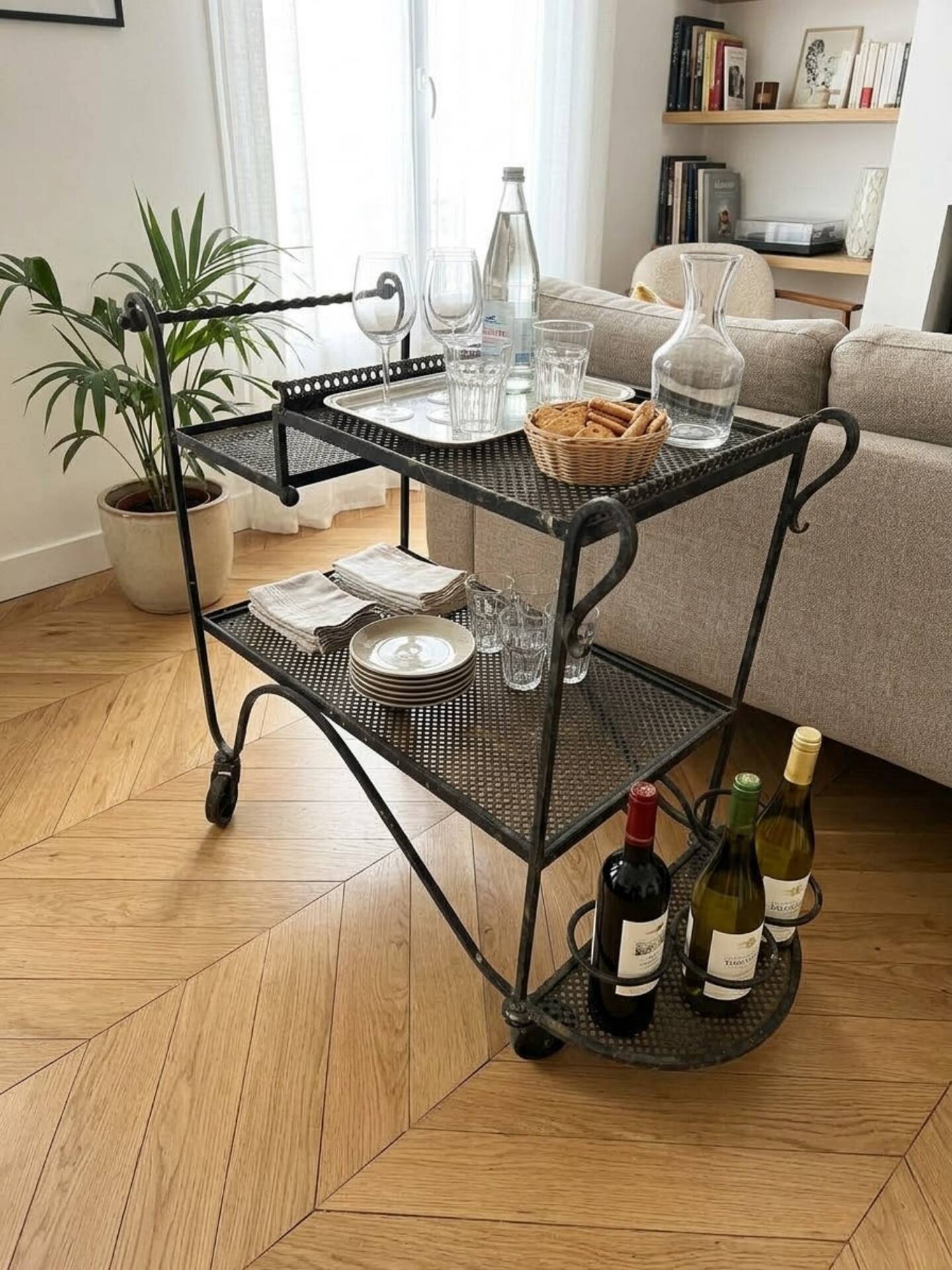 Perforated wrought iron rolling dessert trolley