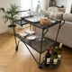 Perforated wrought iron rolling dessert trolley