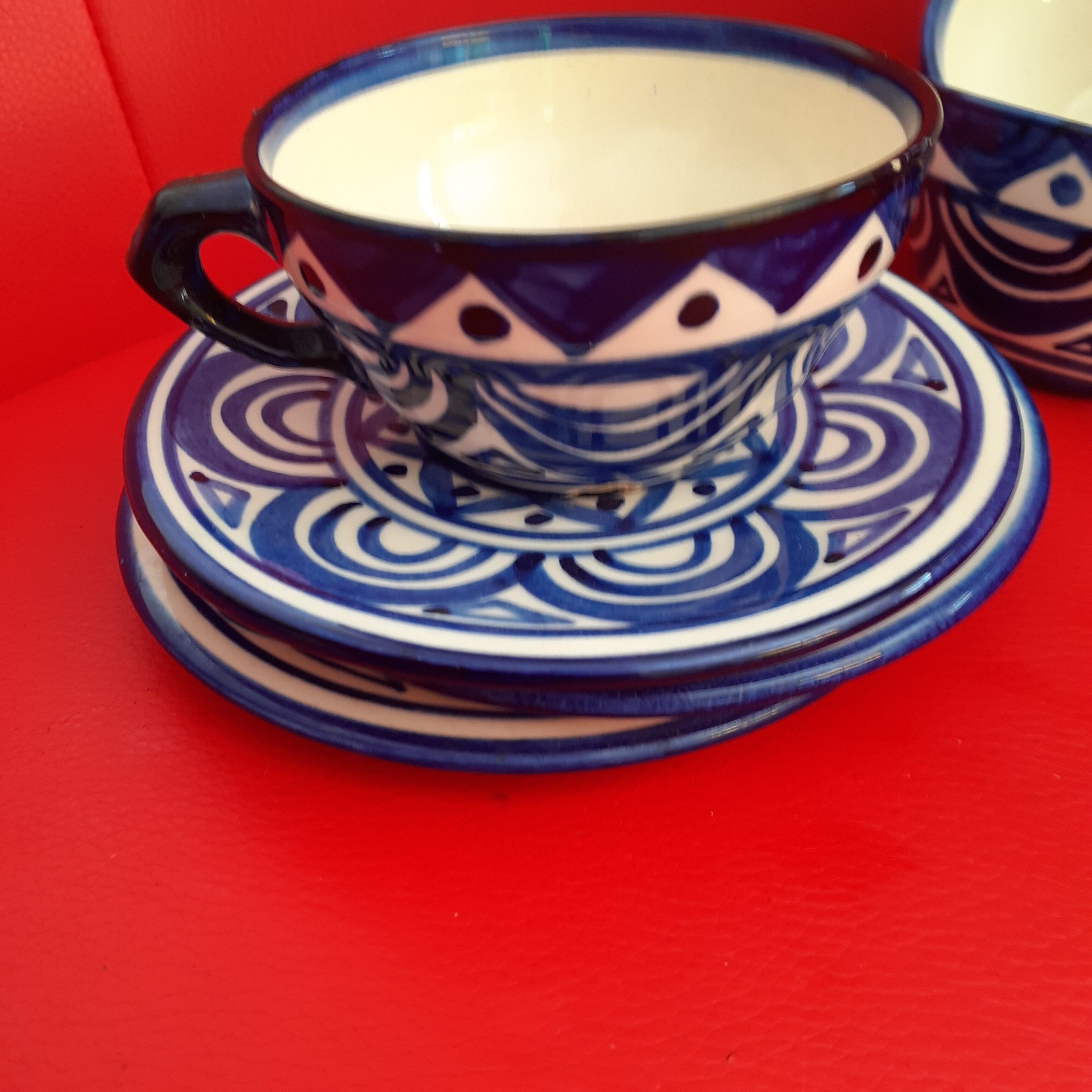 Trio of cups and saucers painted by hand. Blue faience. St John of Brittany.