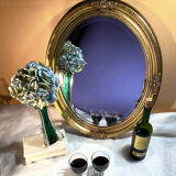 Golden oval mirror finished 62x50cm