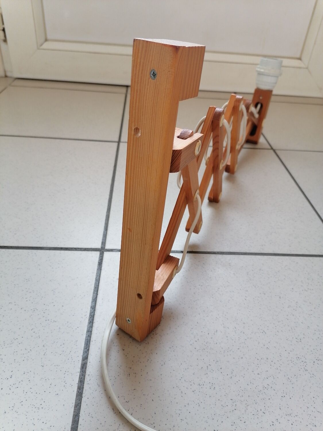 Pair of wooden scissor wall lamps