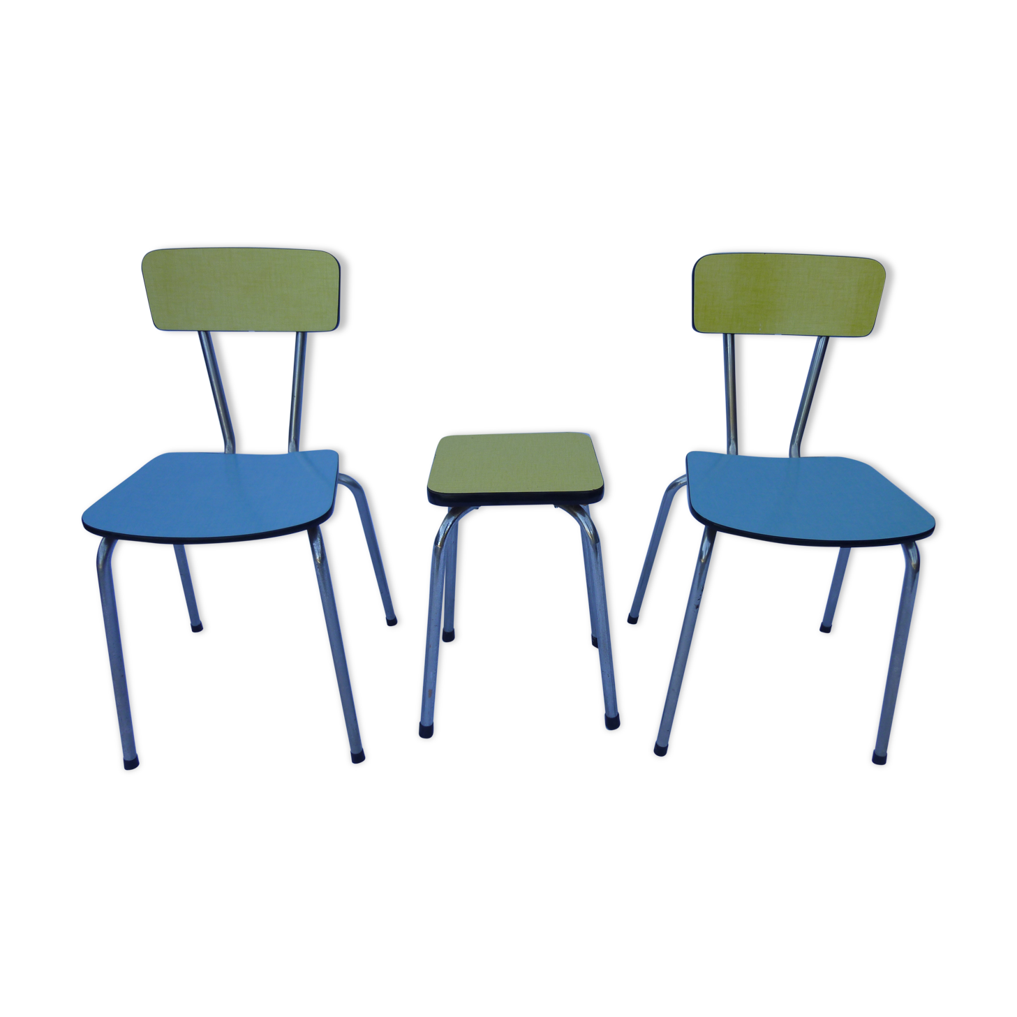 Two chairs and a yellow and blue stool in formica