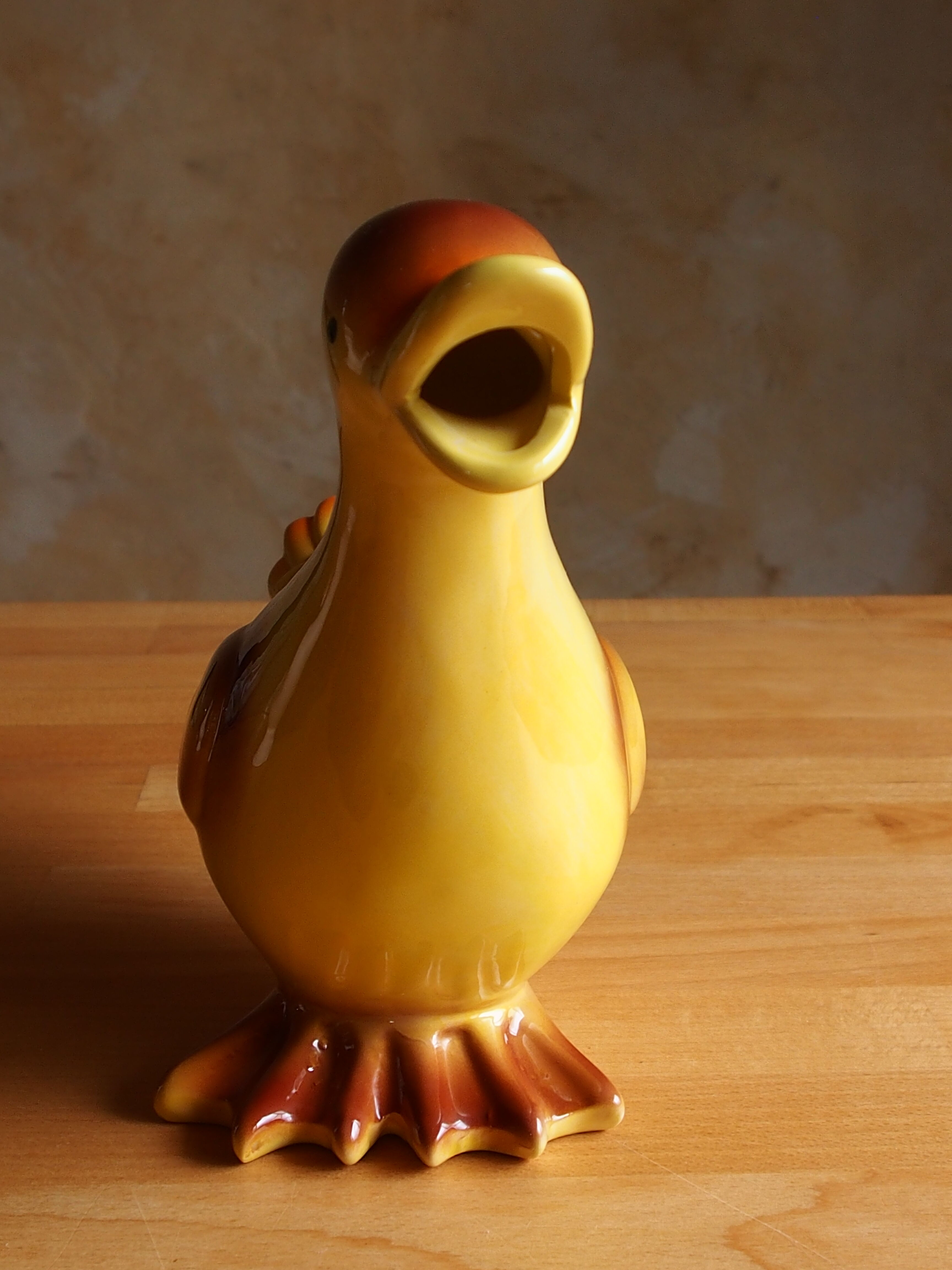 Ceramic watering can in white earthenware, yellow enamel and bird shape