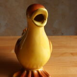 Ceramic watering can in white earthenware, yellow enamel and bird shape