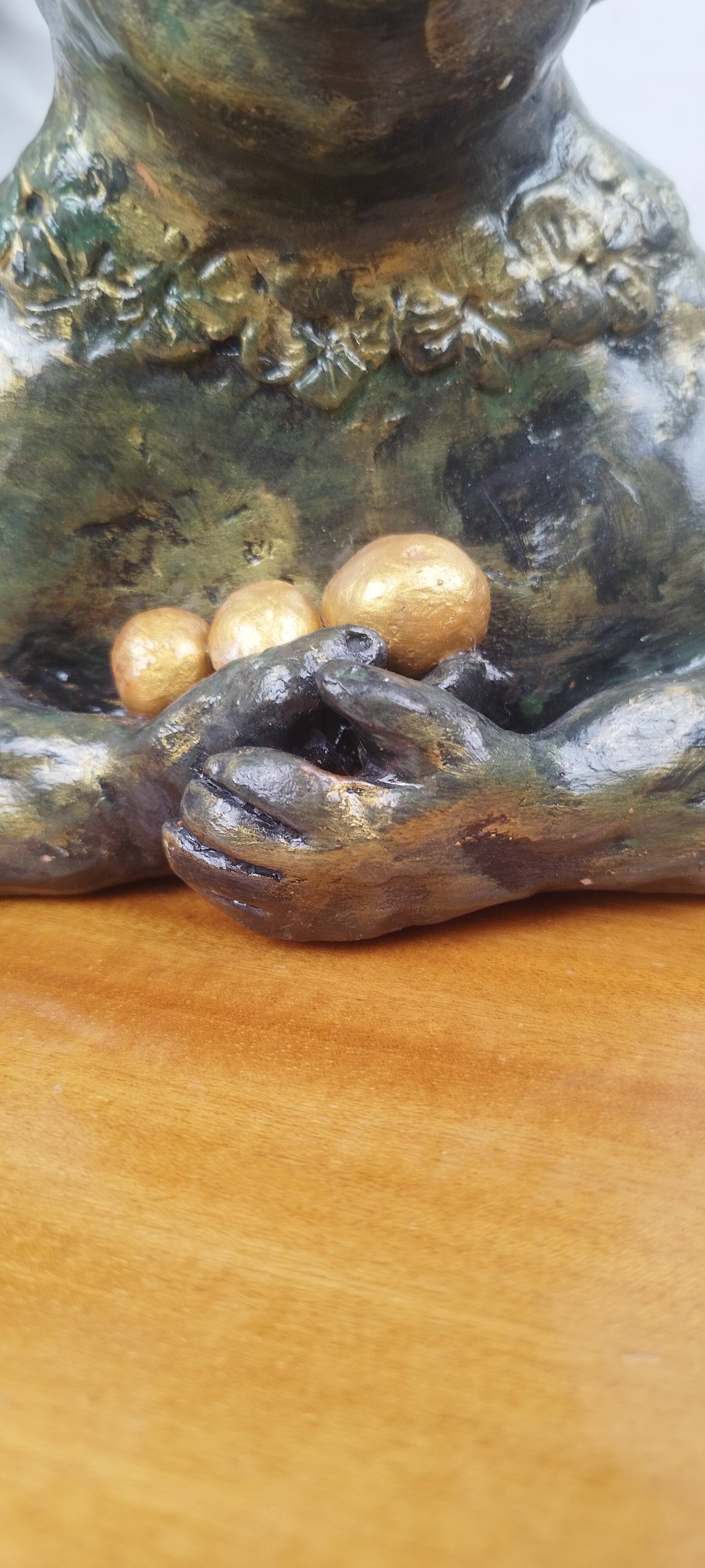 Clay sculpture of mother nature holding eggs, vintage modern figurative art