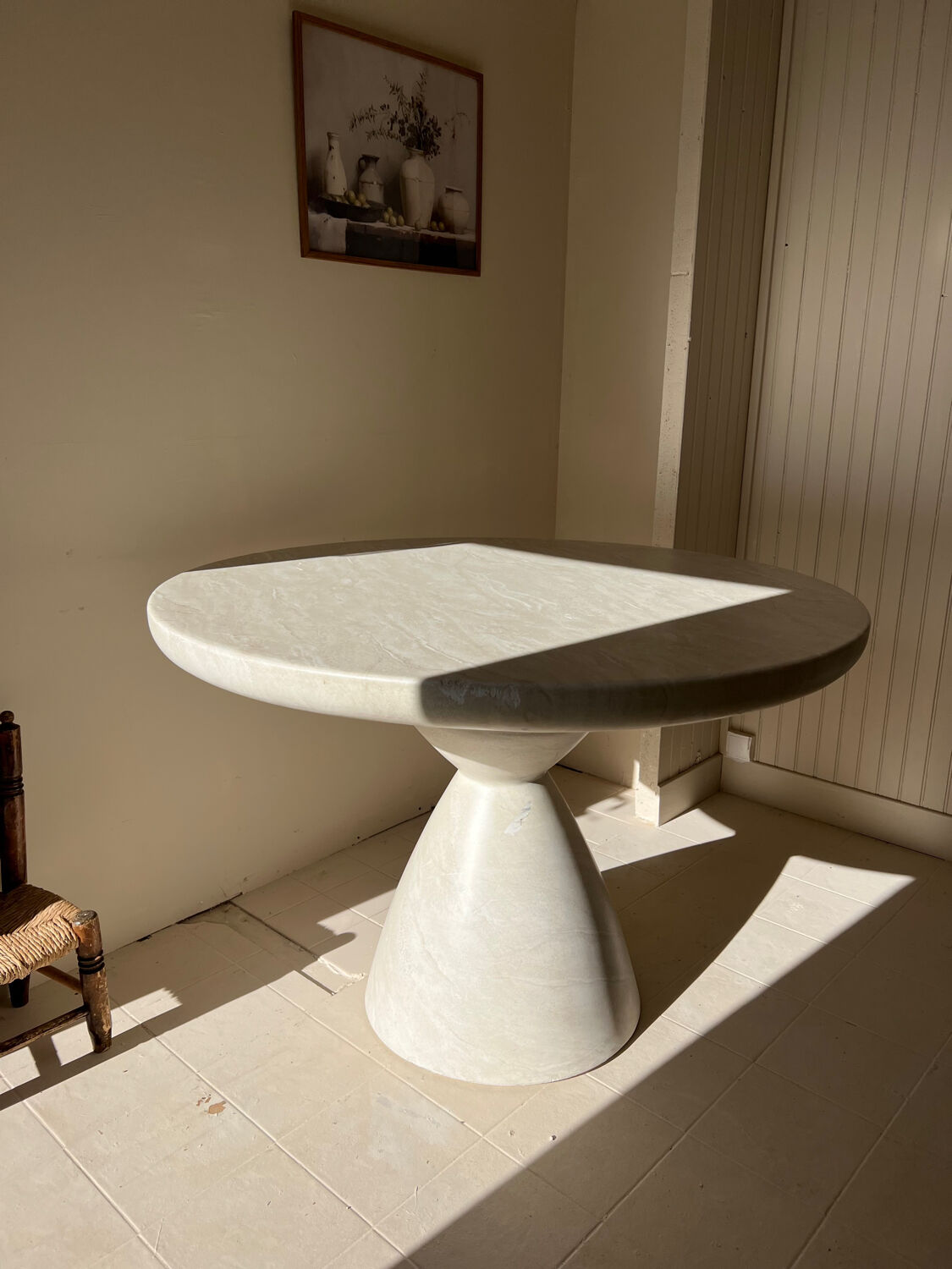 Travertine-effect stone dining table