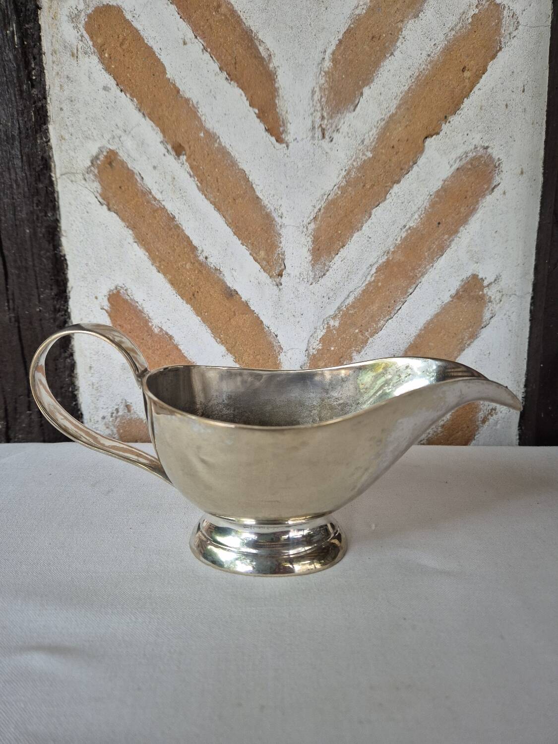 Silver-plated metal gravy boat