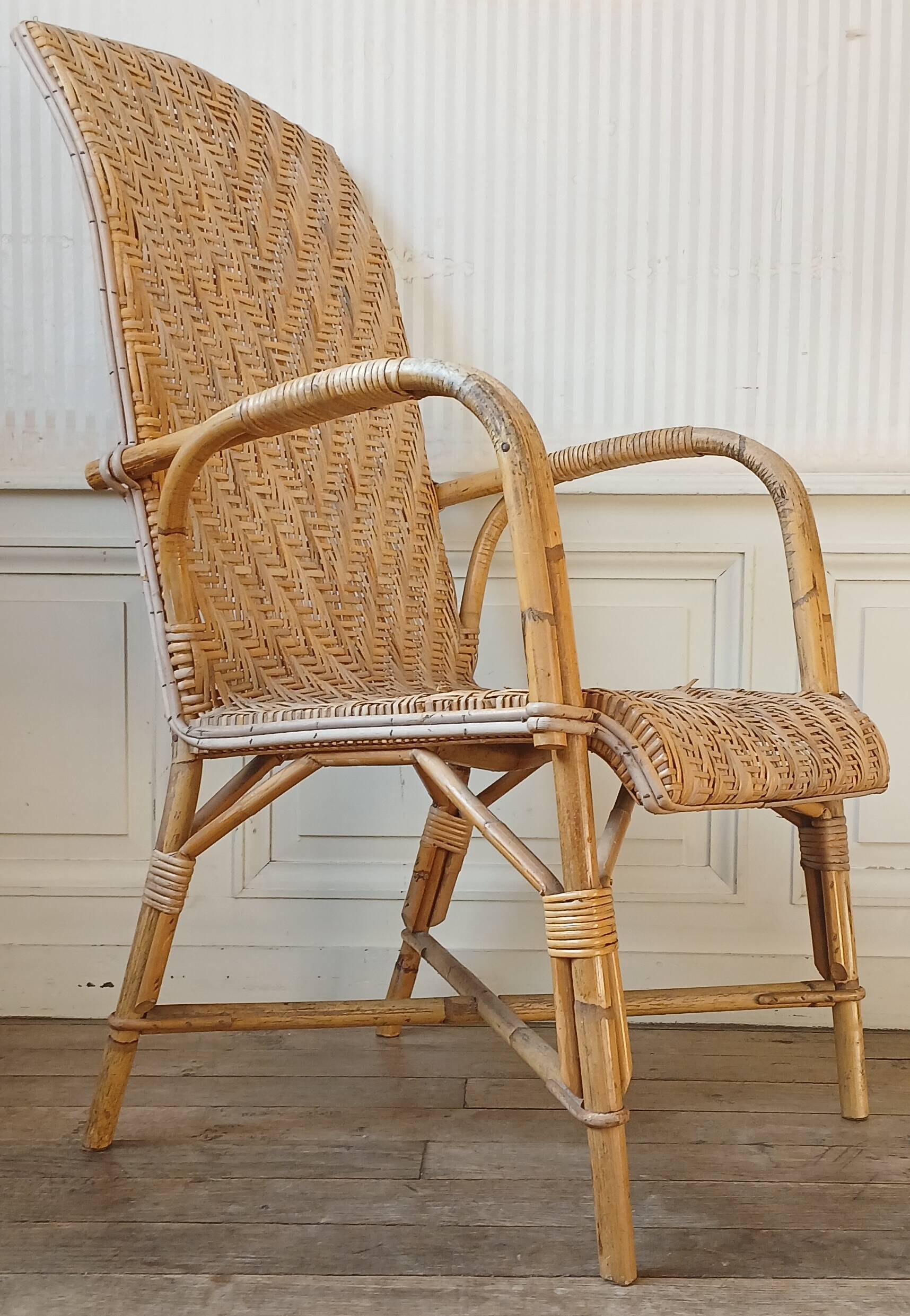 High-backed adult rattan armchair, circa 1960