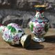 Two small vintage cloisonné enamel vases with Asian floral decoration.
