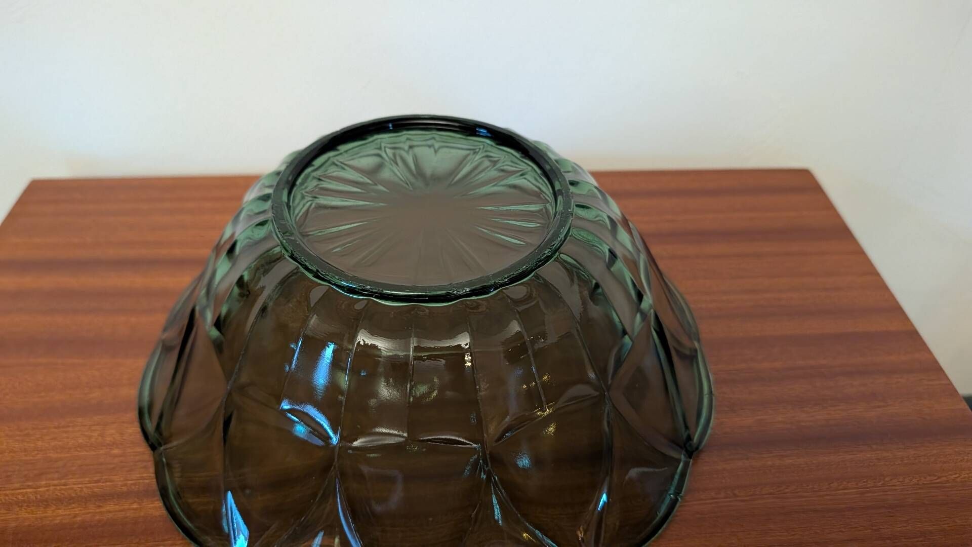 Vintage green smoked glass coupe with geometric decoration.