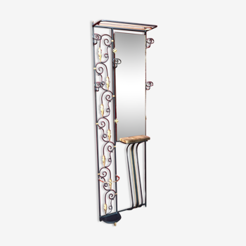 Entrance cloakroom in black and gilded wrought iron