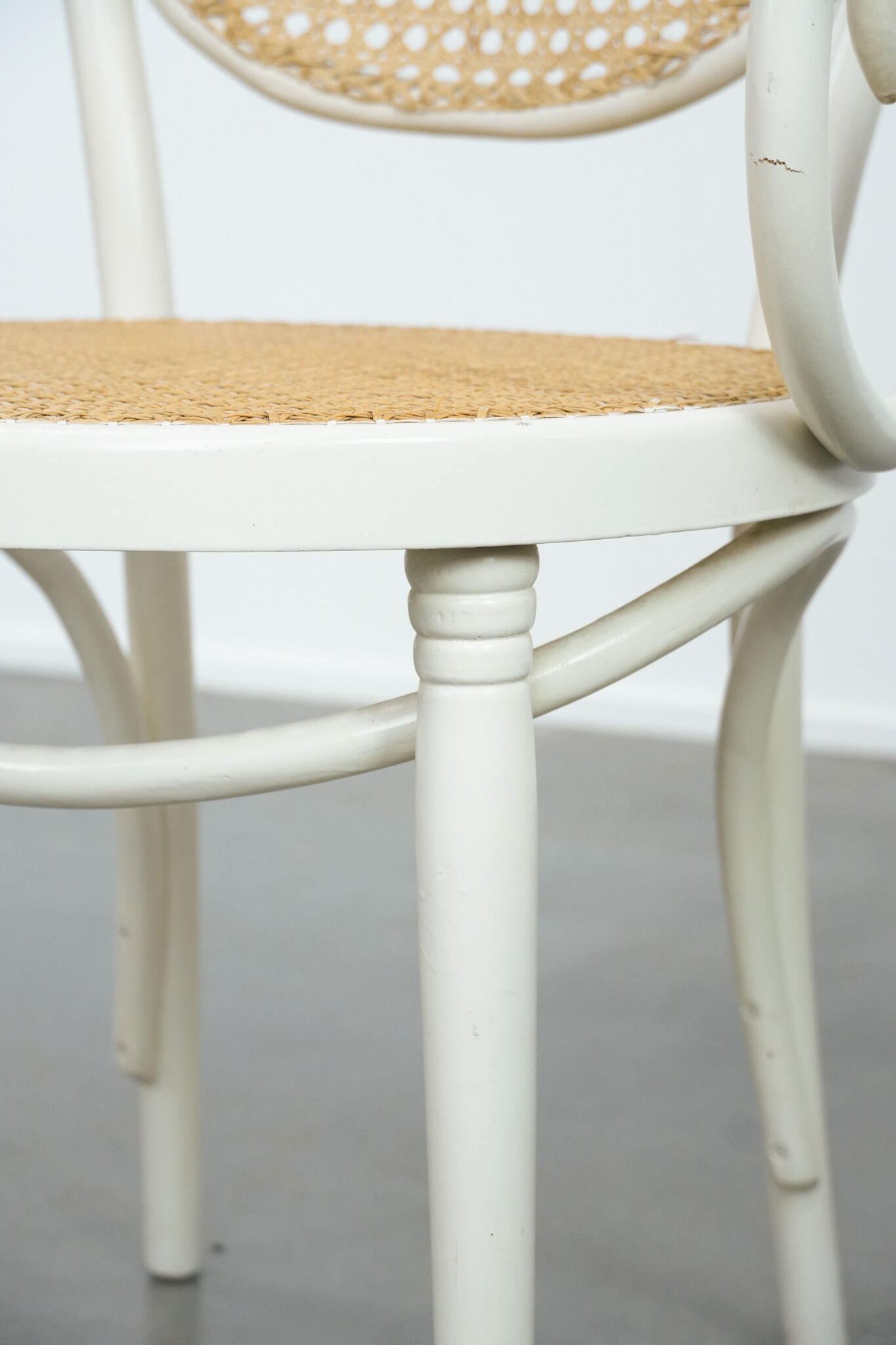 Vintage white bistro chair with armrests in Thonet style