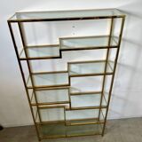 Old shelf in golden metal brass geometric library design 80s vintage