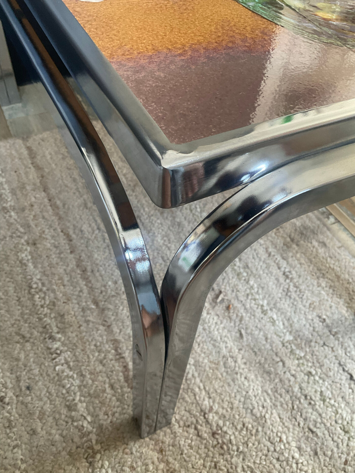 Vintage coffee table in stainless steel and ceramic from the 1970s.