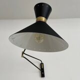 Articulated light in brass
