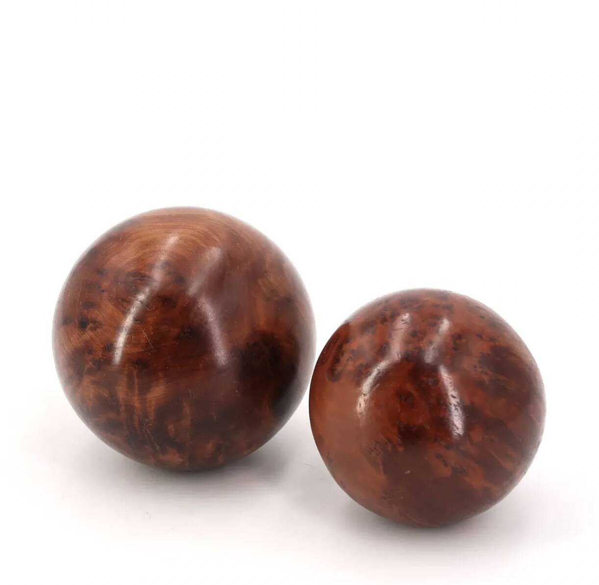 Sculptures of spheres carved in elm burl wood