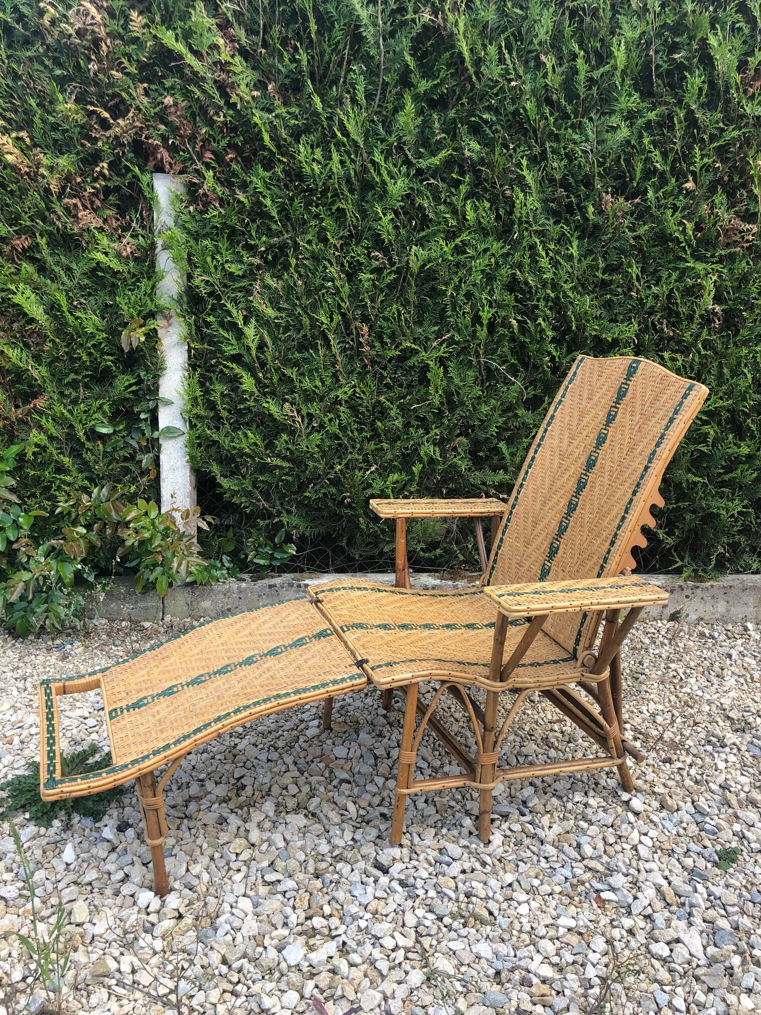 Rattan lounger with foot rest